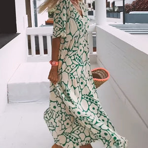 Amélie tryckt V-ringad klänning – elegant och luftig för alla tillfällen