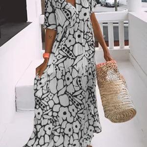 Amélie tryckt V-ringad klänning – elegant och luftig för alla tillfällen